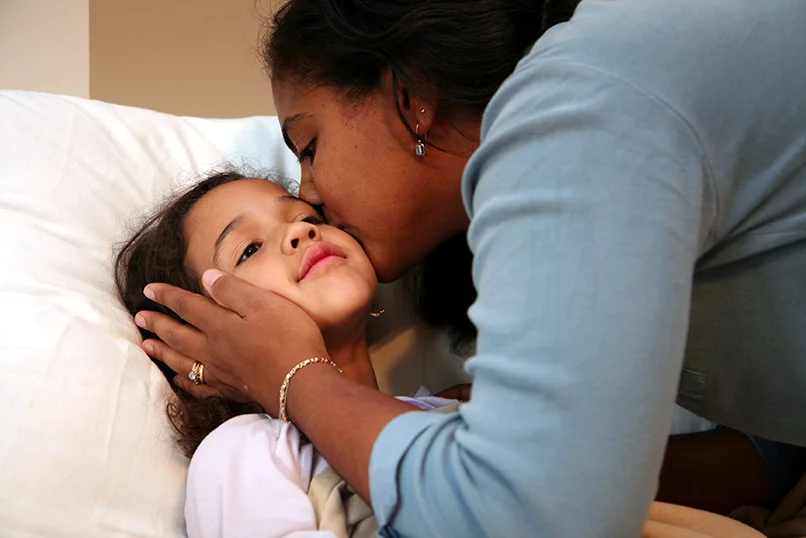 Mother Kissing Her Sick Daughter on the Cheek